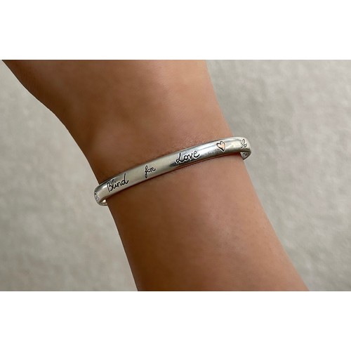 20 - Gucci Silver 'Love Is Blind' Bangle  weighing 13.4 grams