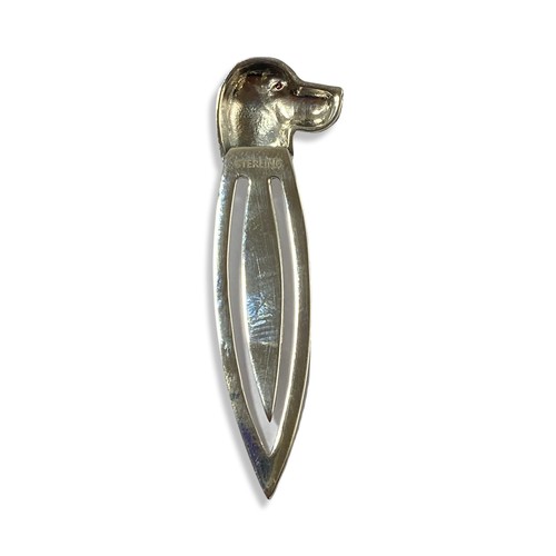 60 - Silver book marker with a dog head design comprising of two red stones as eyes weighing 3.84 grams