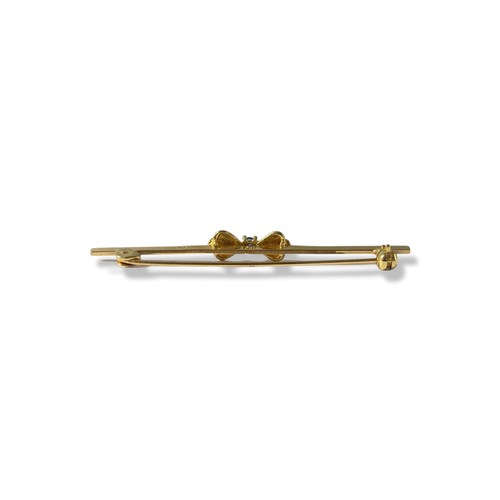 78 - 9ct Gold Chester 1986 diamond and sapphire bow bar brooch weighing 7.93 grams and a length of 5cm