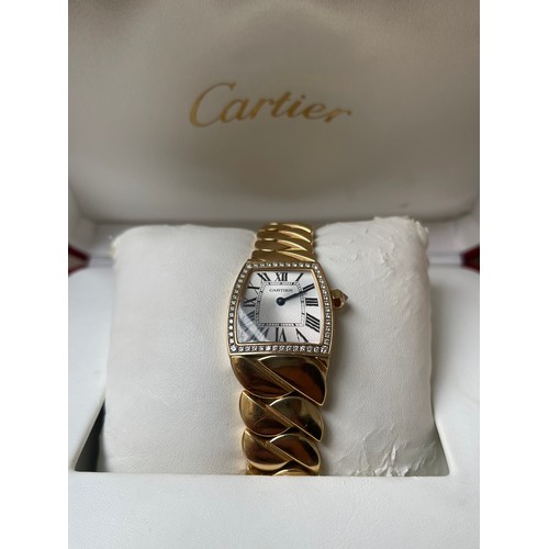 101 - Cartier 18ct Yellow Gold La Dona de Cartier Wristwatch full set. This watch features a silver dial w... 