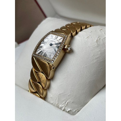 101 - Cartier 18ct Yellow Gold La Dona de Cartier Wristwatch full set. This watch features a silver dial w... 