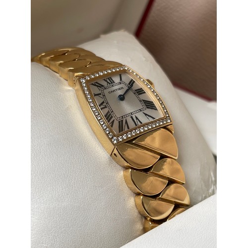 101 - Cartier 18ct Yellow Gold La Dona de Cartier Wristwatch full set. This watch features a silver dial w... 