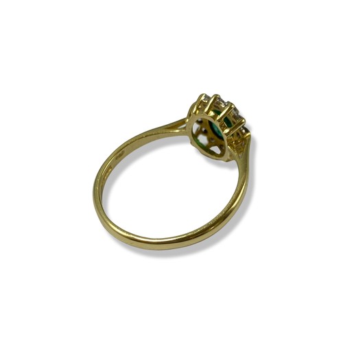 87 - 18ct Yellow Gold Emerald and Diamond cluster ring featuring an oval emerald weighing approximately 0... 