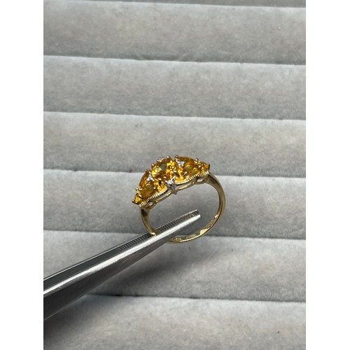 69 - 9ct yellow gold citrine and diamond ring weighing 2.98 grams size P