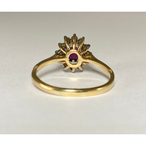 86 - 14ct Yellow gold Ruby and Diamond cluster ring featuring an oval ruby stone weighing approximately 0... 