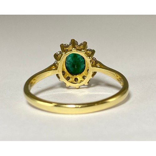 87 - 18ct Yellow Gold Emerald and Diamond cluster ring featuring an oval emerald weighing approximately 0... 