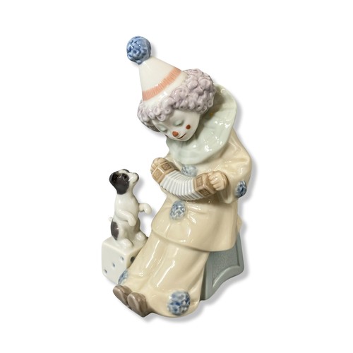 78 - Lladro 5279 Pierrot with puppy and concertina, Good condition. Comes with box