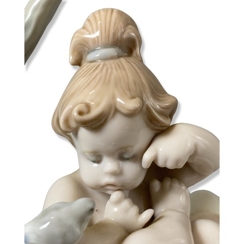 176 - Lladro Signed and dated 6920 Born in springtime, Comes in box, has some damage to one petal