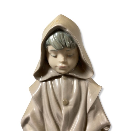 222 - Nao by Lladro Young boy in cloak with dog, Good condition