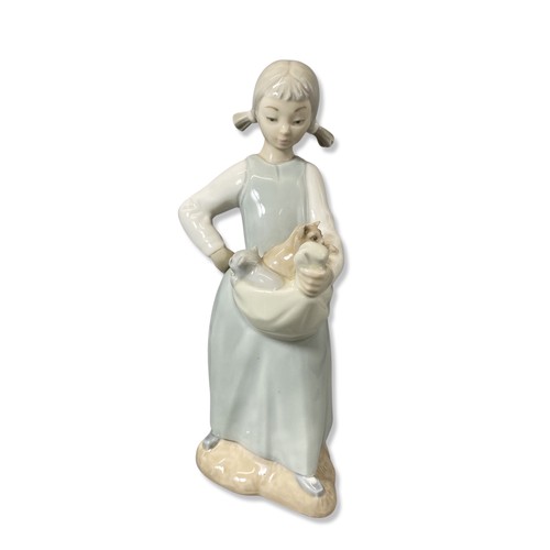 68 - X3 Nao by Lladro figurines to include we're sleepy, girl with kittens, boy with books all in good co... 