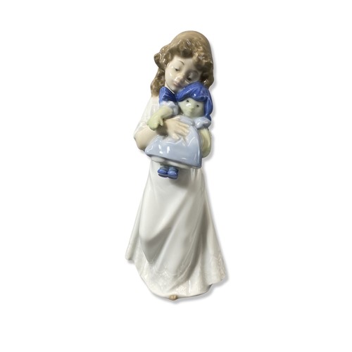 68 - X3 Nao by Lladro figurines to include we're sleepy, girl with kittens, boy with books all in good co... 