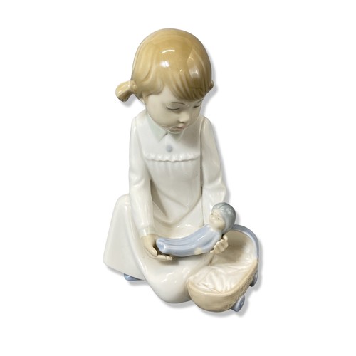 67 - X3 Nao by Lladro figurines to include we're sleepy, ready for bed and girl with doll all in good con... 