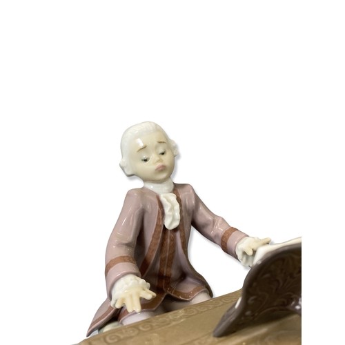 134 - Lladro 5915  Signed and dated Young Mozart Good condition with certificate of authenticity