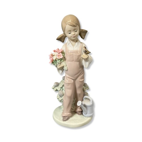 107 - Lladro 5217 Spring girl comes in original box one flower has very slight petal damage