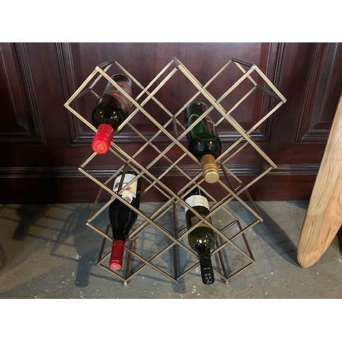 186 - NEW BOXED EXCEPTIONAL DESIGNER WINE RACK IN A BRASS FINISH (APPROX 60CM)