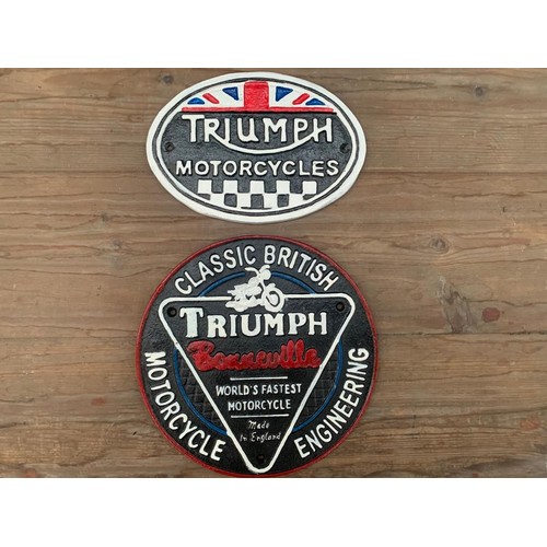 133 - PAIR CAST IRON TRIUMPH MOTORCYCLE SIGNS