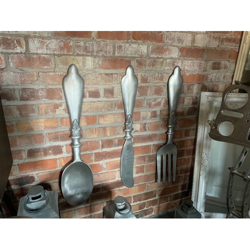 111 - AN OVERSIZED NEW LARGE WALL HANGING BRUSHED NICKEL CUTLERY SET