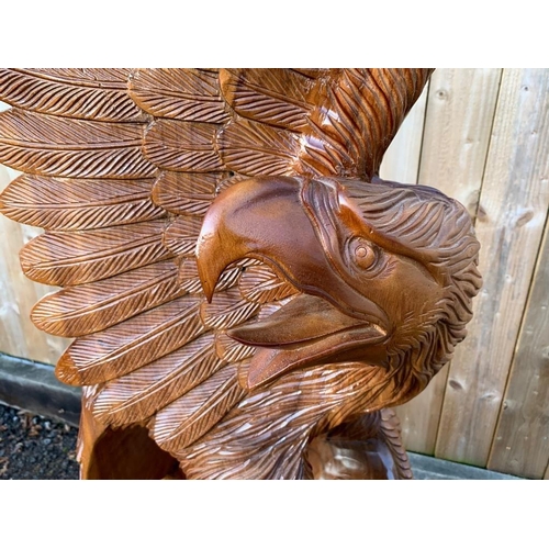 169 - STRIKING HANDCARVED HIGHLY POLISHED 2M HIGH WOODEN DETAILED EAGLE IN MOTION