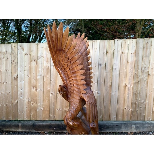 169 - STRIKING HANDCARVED HIGHLY POLISHED 2M HIGH WOODEN DETAILED EAGLE IN MOTION