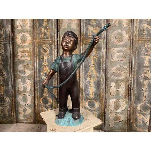 54 - CAST BRONZE FIGURE DEPICTING A BOY HOLDING A HOSE