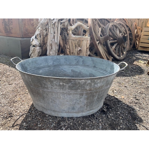 54 - LARGE ANTIQUE ZINC OVAL BATHTUB PLANTER APPROX 90CM-100CM