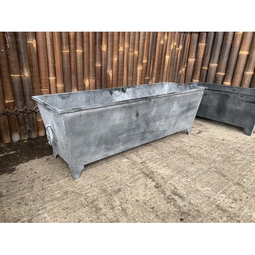 107 - LARGE RECTANGULAR STEEL ORNATE PLANTER ON FEET WITH HANDLES (120.5CM X 40.5CM X 40CM)