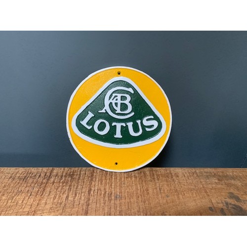 57 - CAST IRON GREEN AND YELLOW LOTUS SIGN