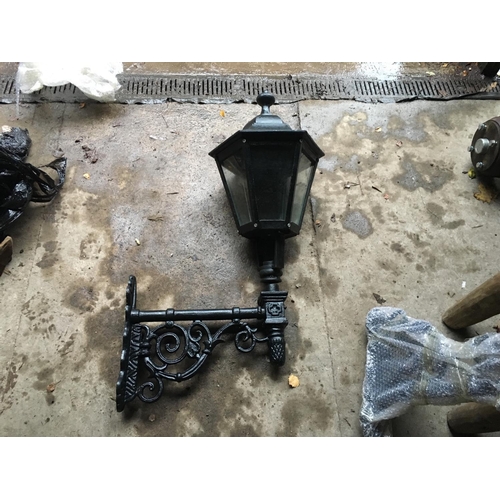 33 - CAST IRON HUGE GLAZED LANTERN ON CAST IRON WALL BRACKET