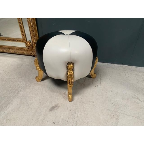 131 - HUGE FRENCH POUFFE ON HANDFINISHED GOLD LEGS AND BLACK/WHITE UPHOLSTERY