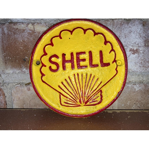 87 - CAST IRON SMALL ROUND SHELL SIGN