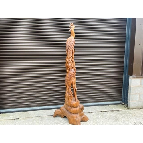 76 - 7FT TALL WOODEN CARVING DEPICTING BIRDS FEEDING