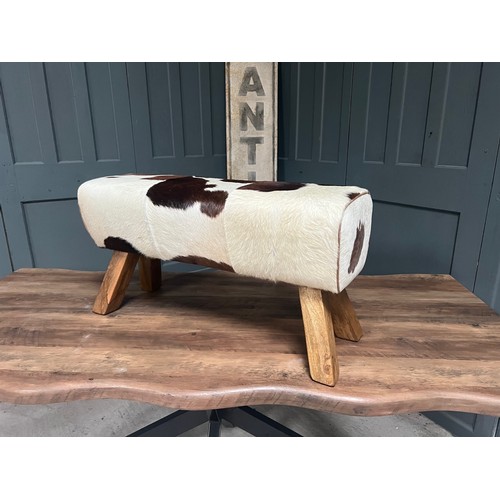 23 - BOXED NEW LARGE BROWN AND WHITE COW HIDE POMMEL HORSE (Due to the nature of the raw cow hide materia... 
