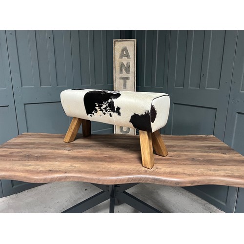 64 - BOXED NEW LARGE BLACK AND WHITE COW HIDE POMMEL HORSE (Due to the nature of the raw cow hide materia... 