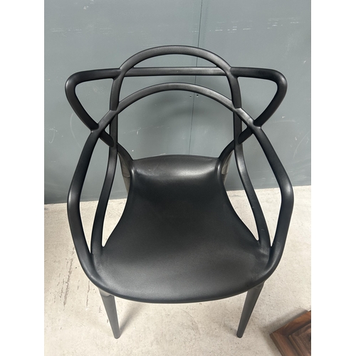 47 - BOX OF 4 NEW DESIGNER PLASTIC PHILIPPE STARCK INSPIRED DINING CHAIRS IN BLACK