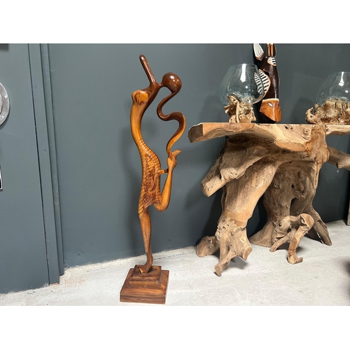 122 - LARGE HEAVY POLISHED WOOD ABSTRACT LADY DANCING ON PLINTH STATUE (APPROX 105CM TALL X 25CM WIDE)