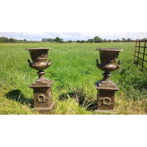 13 - PAIR HEAVY CAST IRON URNS ON PLINTH IN VERDI GREEN BRONZE FINISH