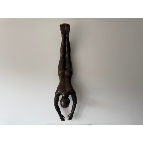 36 - CAST BRASS HANGING WALL SCUPTURE OF A MAN DIVING 120CM LONG