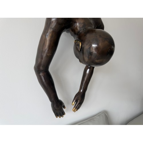 36 - CAST BRASS HANGING WALL SCUPTURE OF A MAN DIVING 120CM LONG