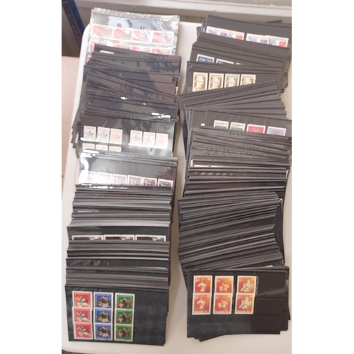 124 - Stockcard (600+) a filebox with many 1000's of stamps, QEII period seem to be sorted by issues or va... 