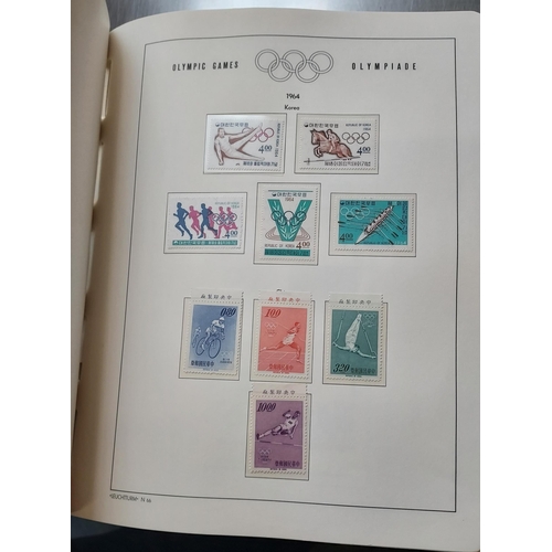 29 - OLYMPIC GAMES 1964 TOKYO - Set of Four Luxurious Lighthouse Hingeless Albums with a substantial coll... 