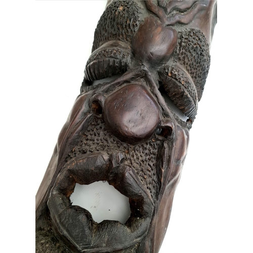 16 - Antiques African Sculptured Wall Grotesque Face Mask 30 inches Tall. With carved baboon or other mon... 