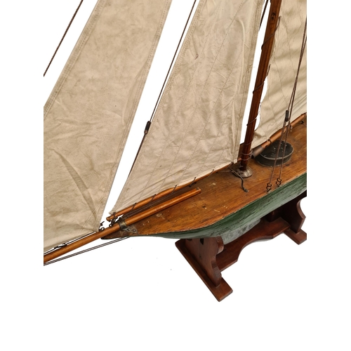 48 - Victorian Pond Yacht Green Hull Fully Rigged Measures 138cm long 147cm tall wooden construction with... 