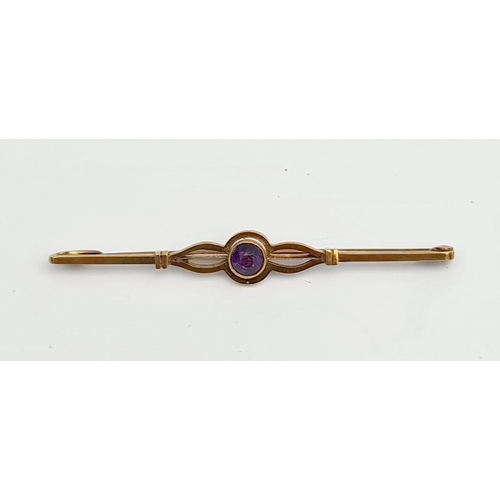 78 - Jewellery 15ct Bar Brooch with Central Amethyst Weight 3g in total Measures 55mm long. Shipping is a... 