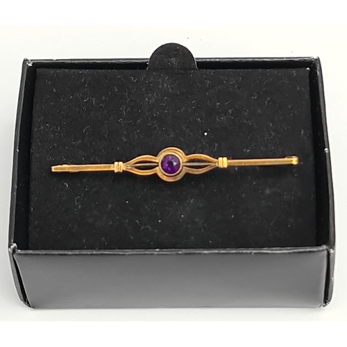 78 - Jewellery 15ct Bar Brooch with Central Amethyst Weight 3g in total Measures 55mm long. Shipping is a... 