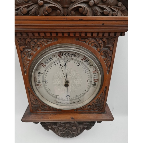 215 - Victorian Large Mahogany Cased Aneroid Barometer. Carved Panels and Pediment. Measures 41 inches by ... 