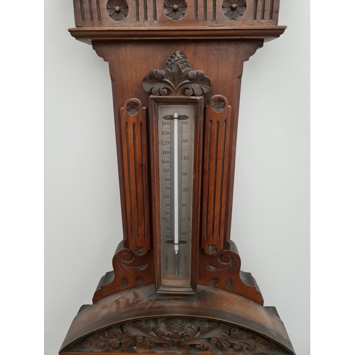 215 - Victorian Large Mahogany Cased Aneroid Barometer. Carved Panels and Pediment. Measures 41 inches by ... 