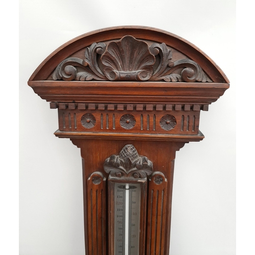 215 - Victorian Large Mahogany Cased Aneroid Barometer. Carved Panels and Pediment. Measures 41 inches by ... 