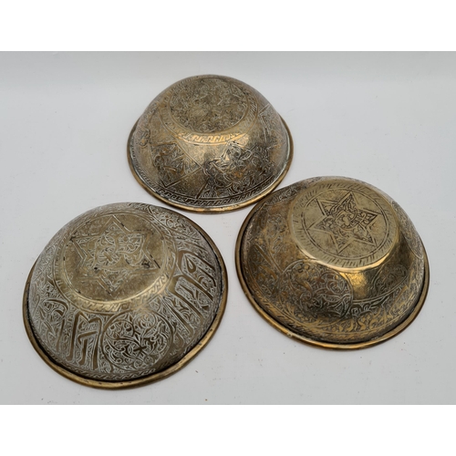 253 - Parcel of  4 Brass Islamic Influenced Bowls. Each Bowl Measures 5 inches diameter by 2 inches tall. ... 