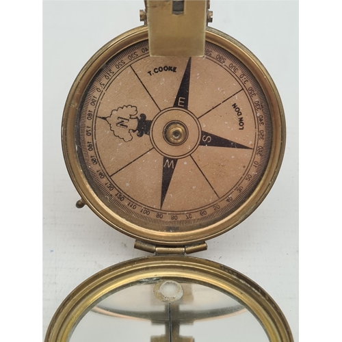 147 - Antiques Brass T Cooke London Compass. 20th Century. Measures 2.5 inches tall. Shipping is available... 