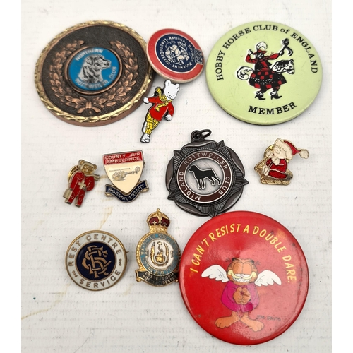 393 - 11 Assorted Badges Includes Rupert, Royal Airforce, Rottweiler Medals and Garfield. Shipping is avai... 